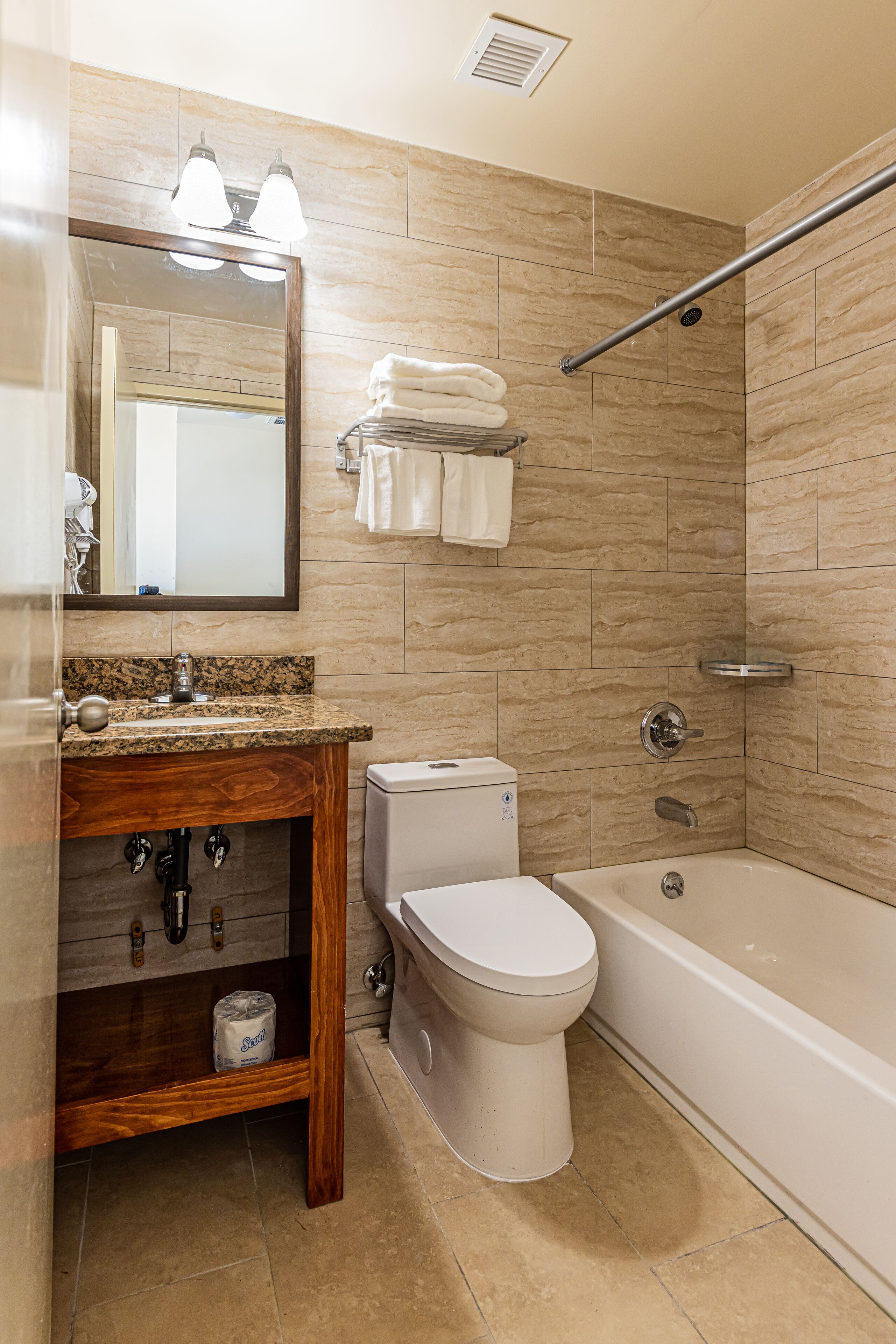 bathtub, hair dryer, towels