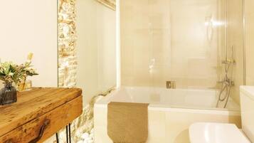 Bathtub, hair dryer, towels
