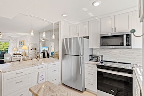 Condo, Multiple Beds | Private kitchen | Fridge, microwave, oven, stovetop