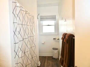 Combined shower/tub, towels, soap, toilet paper