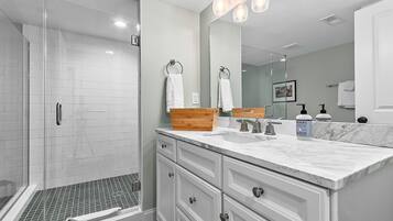 Shower, hair dryer, towels, soap