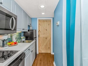 Fridge, microwave, stovetop, coffee/tea maker