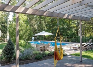 Large in ground pool, pool house patio area & built-in gas grill