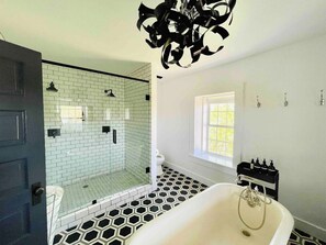 Bathtub, hair dryer, towels, soap