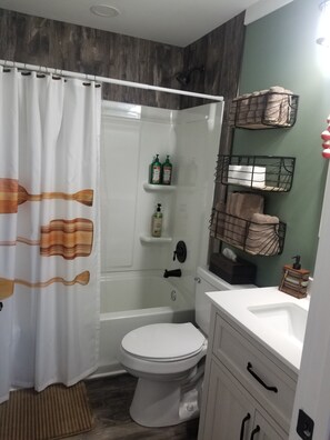 Combined shower/tub, hair dryer, towels, soap