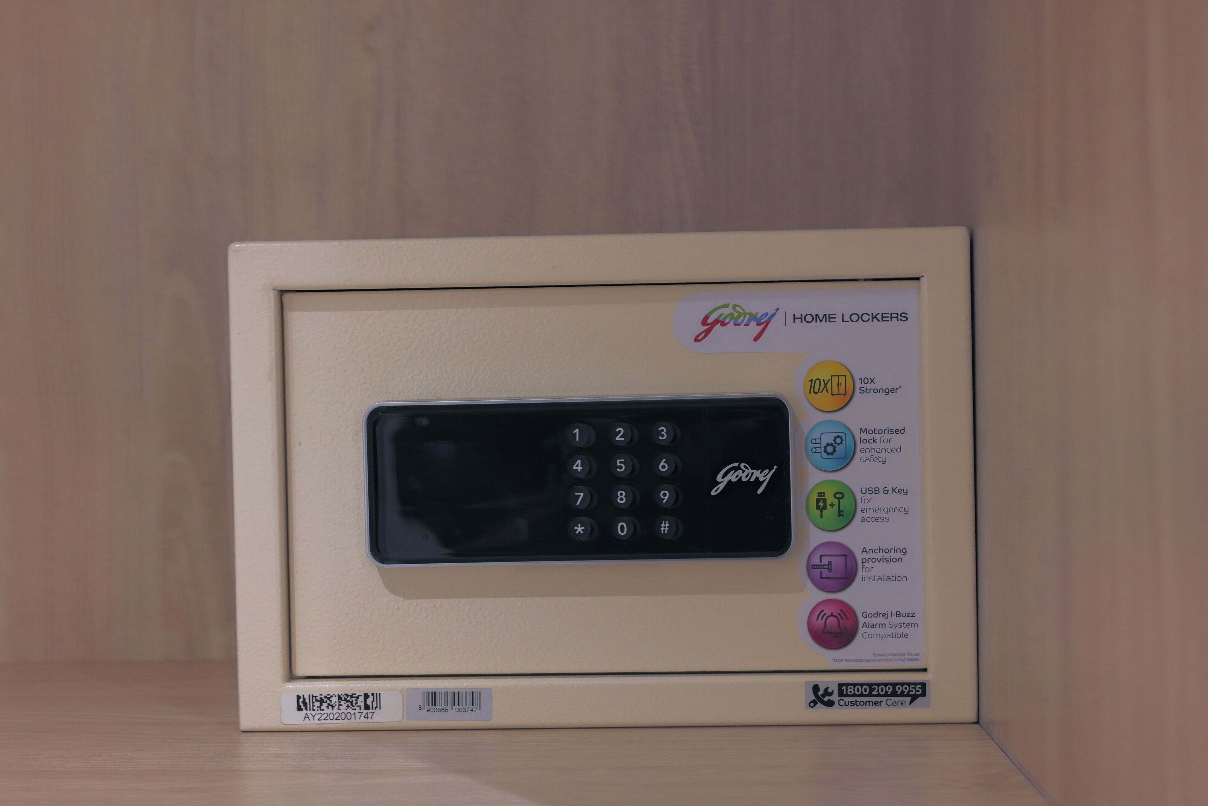 A home security keypad with a display and multiple buttons, including a numeric keypad and a USB port.