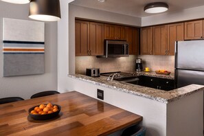 Enjoy cooking in this well-equipped kitchen with a refrigerator, microwave, and coffee maker.