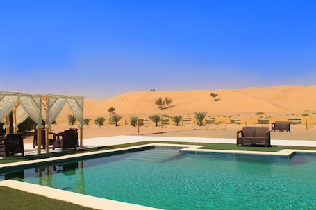 Outdoor pool. Golden Palm Oasis