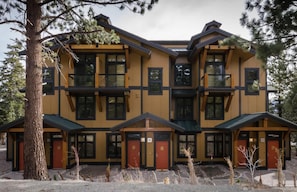 A multi-story building with a symmetrical facade, large windows, and a central entrance. - On the Golf Course! Bright, Updated. Private Gas Grill, Washer/Dryer (Mammoth Lakes)