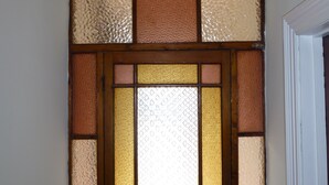 A wooden door with a stained glass window. - Short breaks available!! (St Davids)