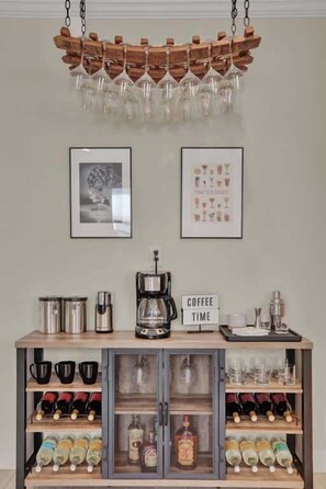 A coffee station with a coffee maker, cups, and a sign that reads 'COFFEE TIME'. - Hot Tub + Fire Pit | Wine Country | Near Main St (Fredericksburg)
