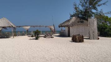 On the beach, sun-loungers, beach towels