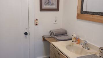 Combined shower/tub, hair dryer, towels, soap