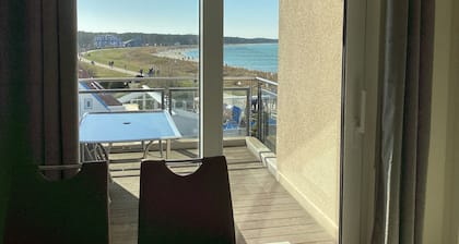 2 balconies directly by the sea, living room, fireplace, 1 bedroom, kitchen, modern bathroom with shower/WC, washing machine.