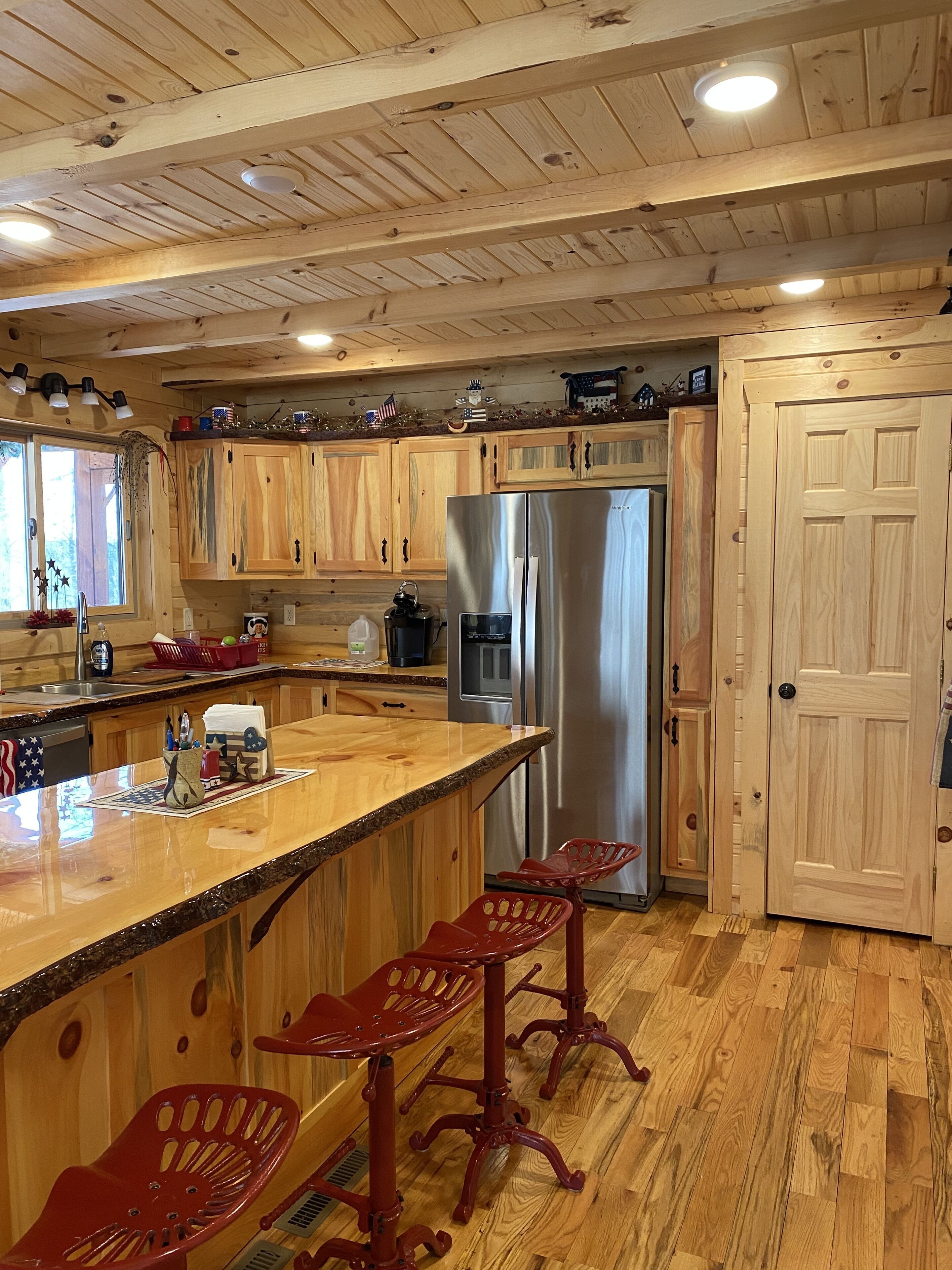 Family log home nestled in the woods just minutes from trails.