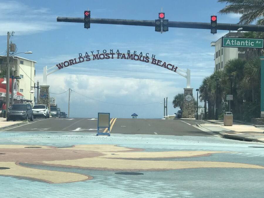 A street view with a traffic light and a sign reading "Atlantic Ave."