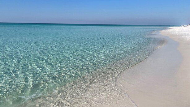 A beach with clear turquoise water and white sand. - GOLF CART - Heated POOL - 3 Kings/1 Queen - Walk to Beach - 5 Patios/Balconies! (Santa Rosa Beach)