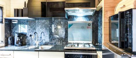 Fridge, stovetop, dishwasher, coffee/tea maker