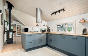 Fridge, stovetop, dishwasher, coffee/tea maker