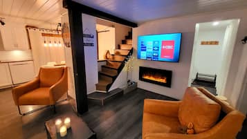 Smart TV, fireplace, table football, books