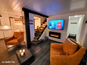 Smart TV, fireplace, table football, books
