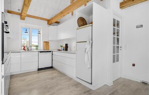 Fridge, stovetop, dishwasher, coffee/tea maker