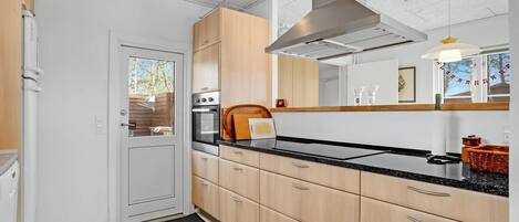 Fridge, stovetop, dishwasher, coffee/tea maker