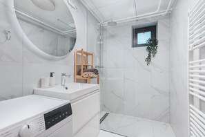 Shower, hair dryer, towels, soap