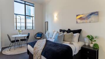 Departamento | 1 habitación, tabla de planchar con plancha, wifi gratis y ropa de cama