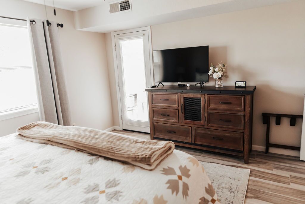 primary bedroom with access to patio