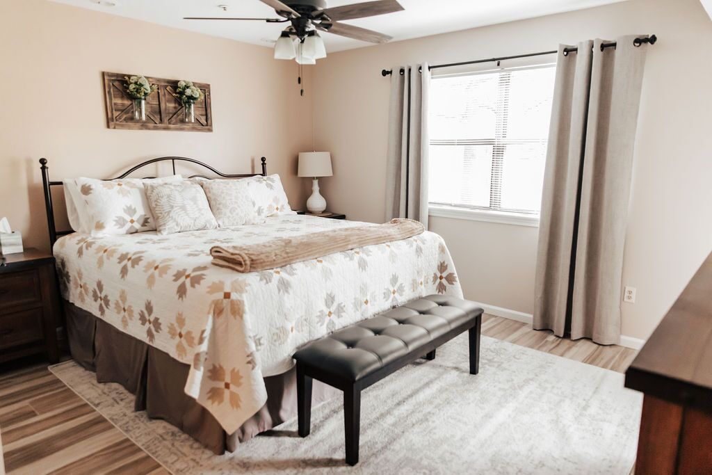 primary bedroom with king size tall bed