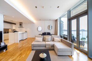 Panoramic Apartment | Living area | 49-inch Smart TV with cable channels, TV - DHH Bluewater Island Building 2 Sea View (Dubai)
