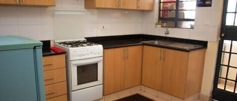 Fridge, microwave, cookware/dishes/utensils