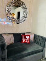 Deluxe Condo | Living area | 55-inch TV with digital channels, Netflix, streaming services