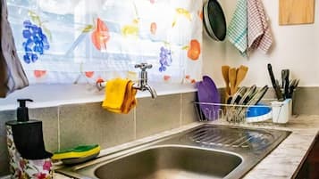 Fridge, microwave, cookware/dishes/utensils