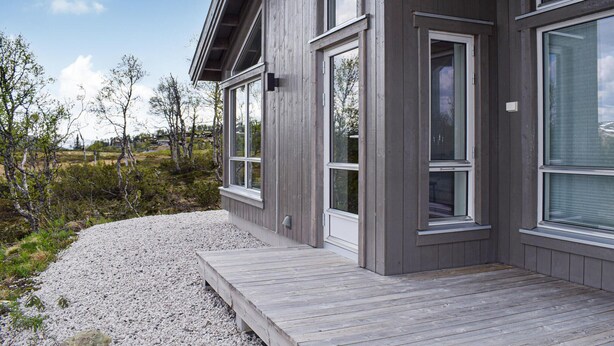 A modern building with large windows and a wooden deck. - Awesome home in Rauland with kitchen (Rauland)