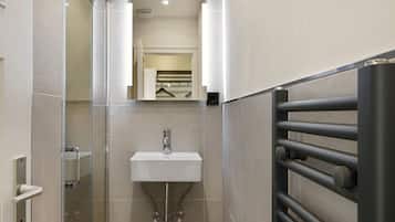 Shower, hair dryer, towels, toilet paper