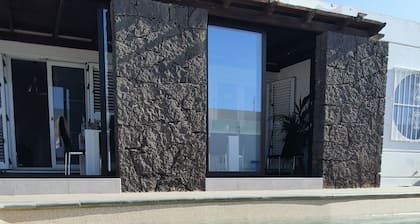 Large 15 ppl. villa with garden and heated pool near the center of Playa Blanca