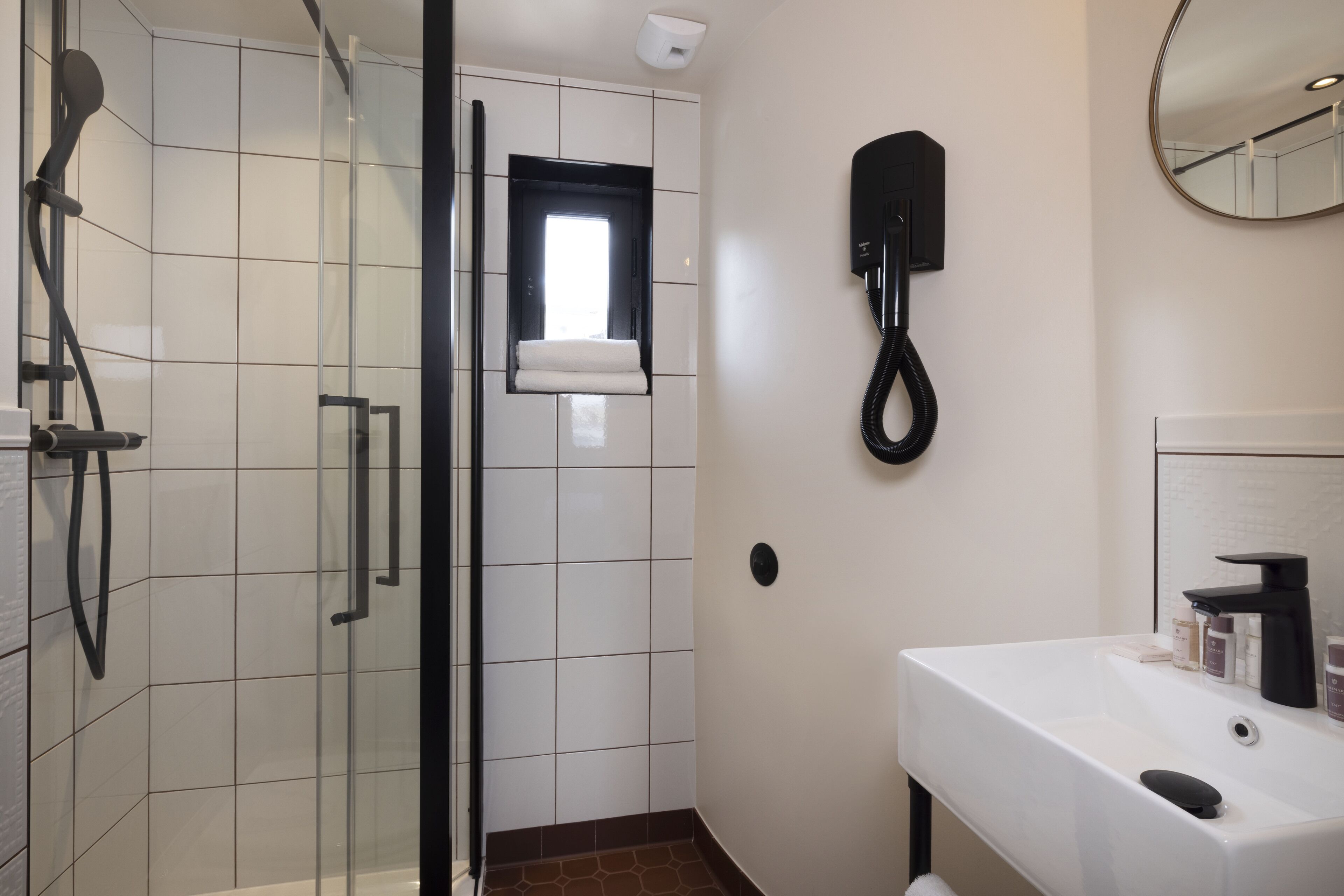 panoramic studio | bathroom | shower, hair dryer, slippers, towels