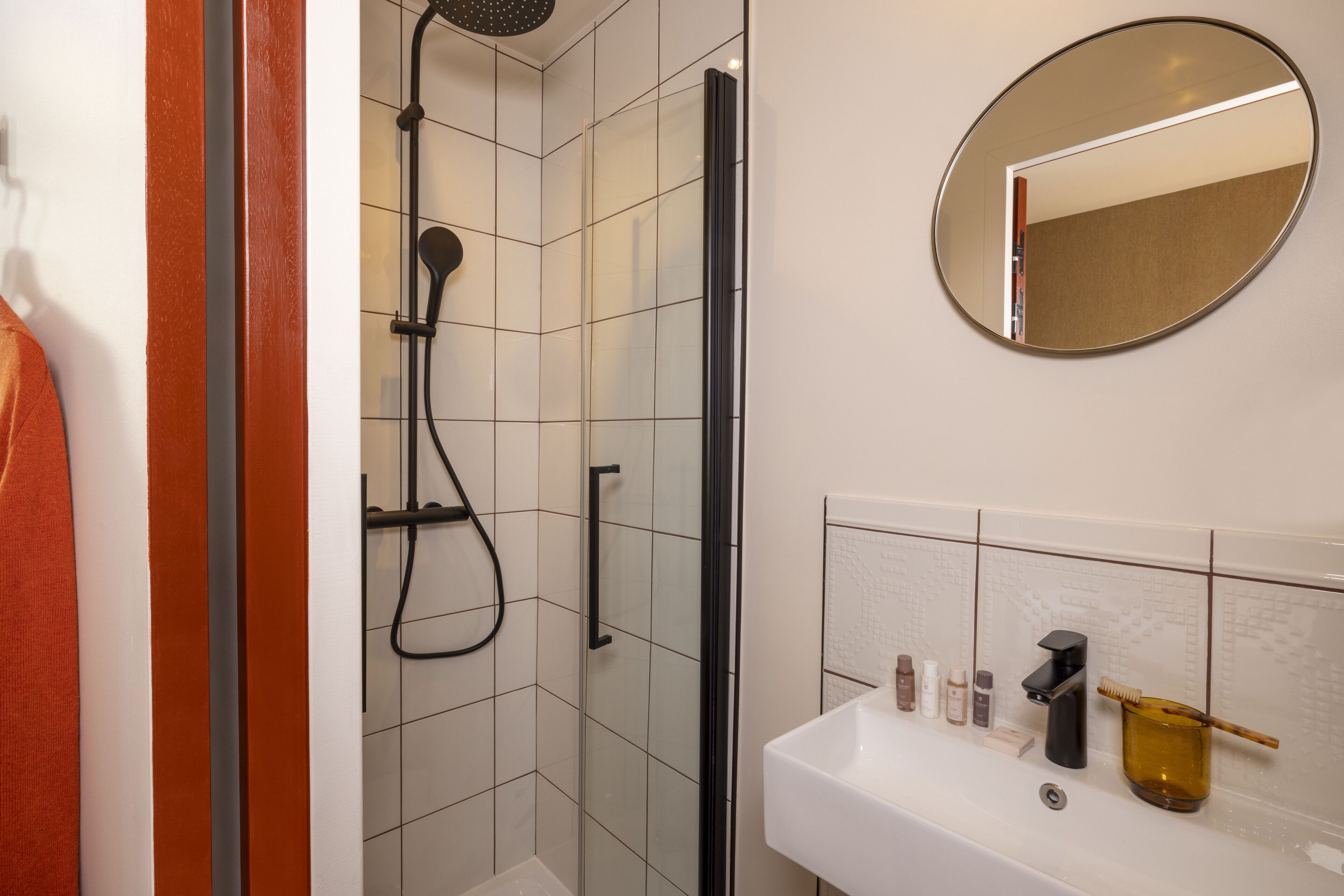 classic single room | bathroom | shower, hair dryer, slippers, towels
