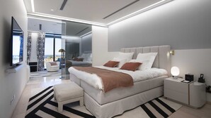 Un dormitorio moderno con una cama grande, mesitas de noche y un televisor.