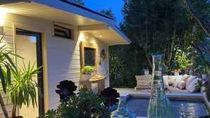 A modern house with a pool, potted plants, and outdoor seating. - Mini Villa With Jacuzzi (Cagnes sur mer)