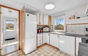 Fridge, stovetop, dishwasher, coffee/tea maker