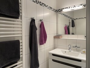 Shower, hair dryer, towels, toilet paper