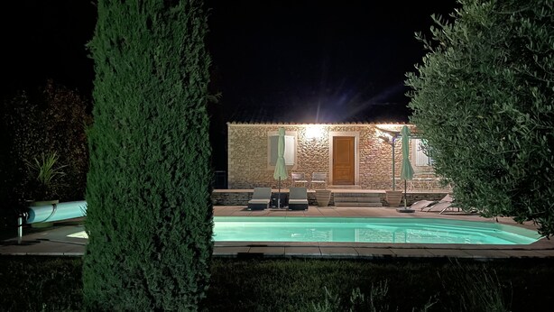 A stone building with a pool, surrounded by tall trees. - House La Luberonne Gordes Vaucluse Provence. Heated pool from May 15. (Gordes)