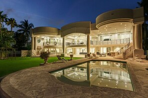 A multi-level, modern building with a pool and outdoor seating. - 8500sf Intracoastal Mansion/Cinema/Dock/Pool (Hollywood)