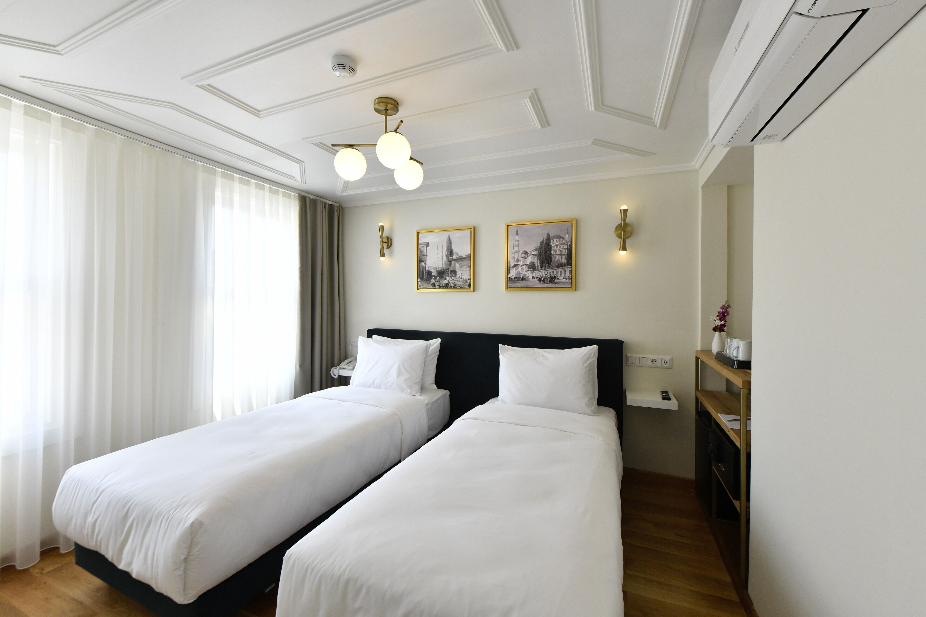 standard double or twin room | minibar, in-room safe, blackout curtains, iron/ironing board