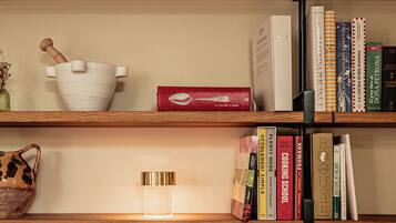 A bookshelf with various decorative items and books.