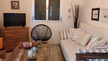 Basic Villa | Living area | Flat-screen TV