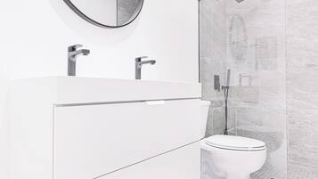 Bathtub, hair dryer, towels
